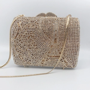 Golden Eiffel Tower evening clutch with sparkling rhinestones and metal chain strap