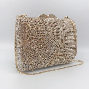 Champagne gold evening clutch bag with Eiffel Tower rhinestone pattern and metal chain