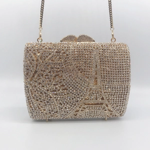 Elegant gold evening clutch bag with Eiffel Tower rhinestone pattern and chain strap