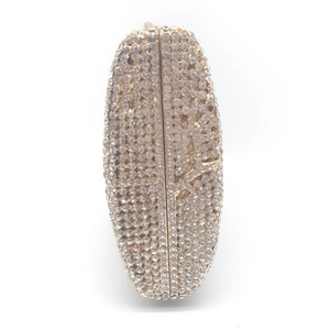 Elegant oval evening clutch bag with sparkling white rhinestones and light gold frame