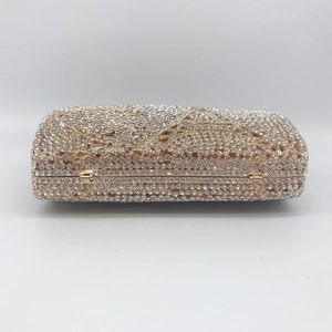 Luxurious gold evening clutch bag with full rhinestone inlay and metal frame for formal events