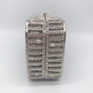 Elegant silver rhinestone clutch bag with luxury metal frame and top clasp closure