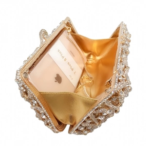 Gold starfish crystal evening bag with metal frame and chain showing interior phone capacity