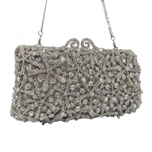 Detail of silver starfish evening clutch with crystal rhinestones and metal chain