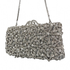 Detailed macro shot of premium silver evening clutch bag with sparkling hand-set crystals