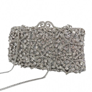 Detail of silver starfish evening clutch with hollow metal clasp and rhinestone texture