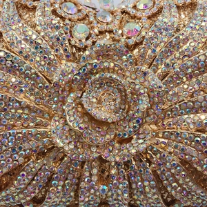 Macro detail of luxury evening clutch with sparkling rhinestones in a rose flower design
