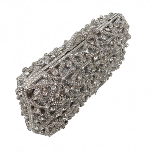 Detail of silver starfish evening clutch featuring hollow metal frame and inlaid crystals
