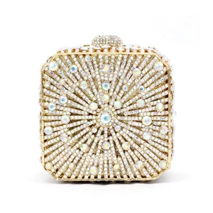 Luxury gold evening clutch bag with radiating crystal rhinestones and metal frame