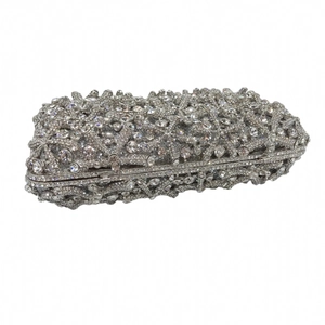 Close-up of silver starfish evening clutch with sparkling rhinestones and metal frame