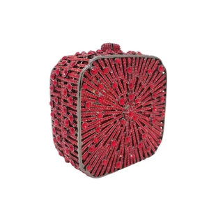 Macro detail of red rhinestone evening clutch bag with sparkling diamond surface