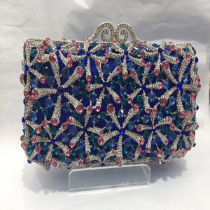 Detail of starfish pattern evening clutch with hollow metal and colorful crystals