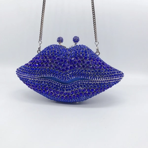 Sparkling royal blue lip-shaped evening clutch bag with rhinestones and metal chain strap