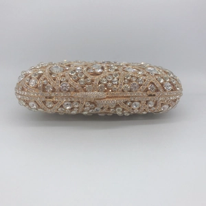 Luxurious gold hollow metal clutch bag with sparkling rhinestones for evening parties