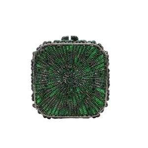 Close-up of green rhinestone evening clutch bag with radiating pattern and metal frame