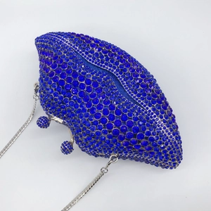 Lip-shaped evening clutch bag with blue rhinestones and silver metal chain strap
