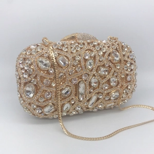 Elegant gold hollow metal evening clutch bag with sparkling crystals and a chain strap