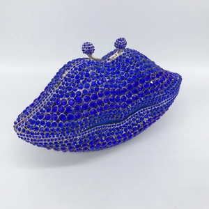 Navy blue lip shaped evening clutch bag fully covered in sparkling rhinestones