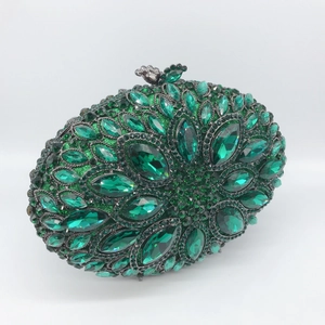 Luxurious dark green hollow metal dinner clutch with emerald rhinestones and floral design