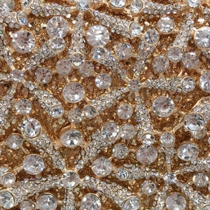 Champagne gold starfish clutch with sparkling crystals and hollow metal frame for gala