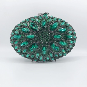 Elegant oval evening clutch bag with emerald green rhinestones in floral pattern