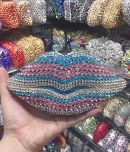 Detail of a lip-shaped clutch bag fully encrusted with colorful sparkling rhinestones