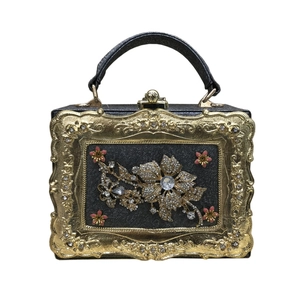 Vintage evening handbag with gold Baroque frame and rhinestone floral pattern