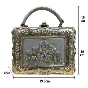Detailed dimensions of the gold evening bag with rhinestone flower and relief frame