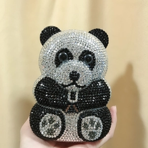 Detailed view of handmade panda crystal clutch bag with black and white rhinestones