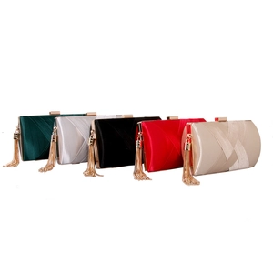 Elegant woven silk evening clutches with tassel in green, silver, black, red, and gold