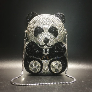 Detailed view of the sparkling crystal-encrusted panda evening clutch bag with silver chain