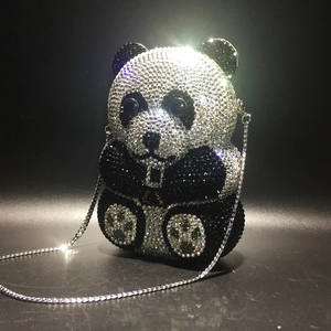 Macro shot of handcrafted panda crystal evening bag with intricate rhinestone detailing