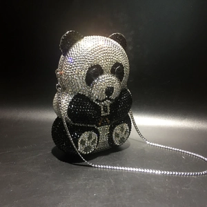 Detailed view of panda-shaped evening clutch with full black and white crystal embellishments