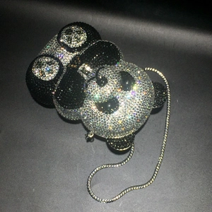 Detailed view of handmade panda crystal evening bag with white and black rhinestones