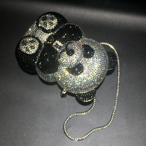Detailed view of handmade panda crystal evening bag with black and silver rhinestones