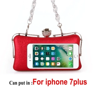 Red evening clutch with silk metallic texture, silver chain, and diamond rose clasp