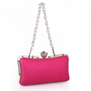 Elegant fuchsia satin evening clutch bag with sparkling floral diamond clasp and silver chain