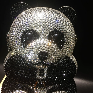 Exquisite close-up of handmade black and white panda evening bag with crystals