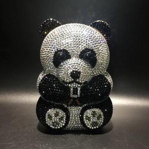 Detailed close-up of high-density rhinestones on a panda-shaped evening clutch bag