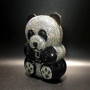 Close-up of a panda-shaped evening clutch bag with black and white crystal rhinestones