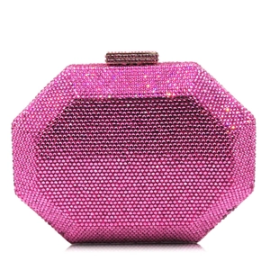 Close-up of octagon crystal evening clutch bag with rose pink rhinestones and metal clasp