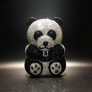 Exquisite close-up of handmade crystal-encrusted panda evening clutch with black and white rhinestones