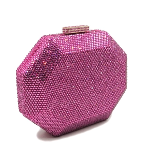 Macro detail of high-shine rose pink crystals on octagonal evening clutch bag surface