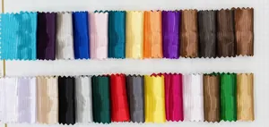 Selection of 26 colors for pleated silk evening bags displayed on a fabric swatch grid
