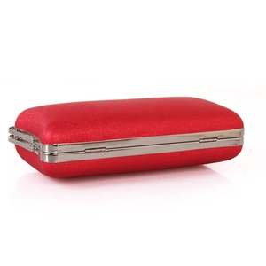 Detailed side view of red satin evening clutch with silver metal frame and push-lock