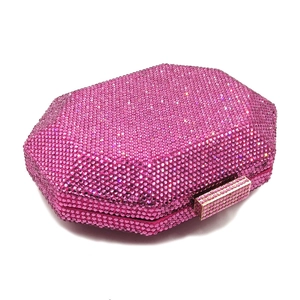 Macro shot of rose red crystal octagonal clutch featuring luxury rhinestone lock detail