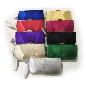 Detailed view of evening clutch bags showing nine colors and crisscross pleat textures