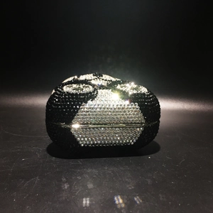 Detailed view of handmade panda crystal clutch with black and white rhinestones