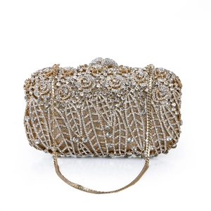 Detailed view of the gold hollow rose metal clutch with sparkling crystals and fine chain