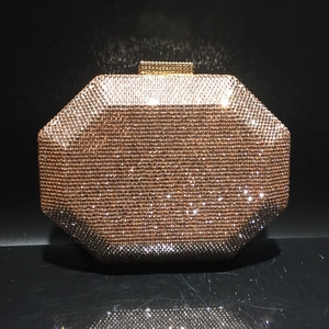 Macro view of octagon crystal evening clutch with champagne gold rhinestones and metal clasp